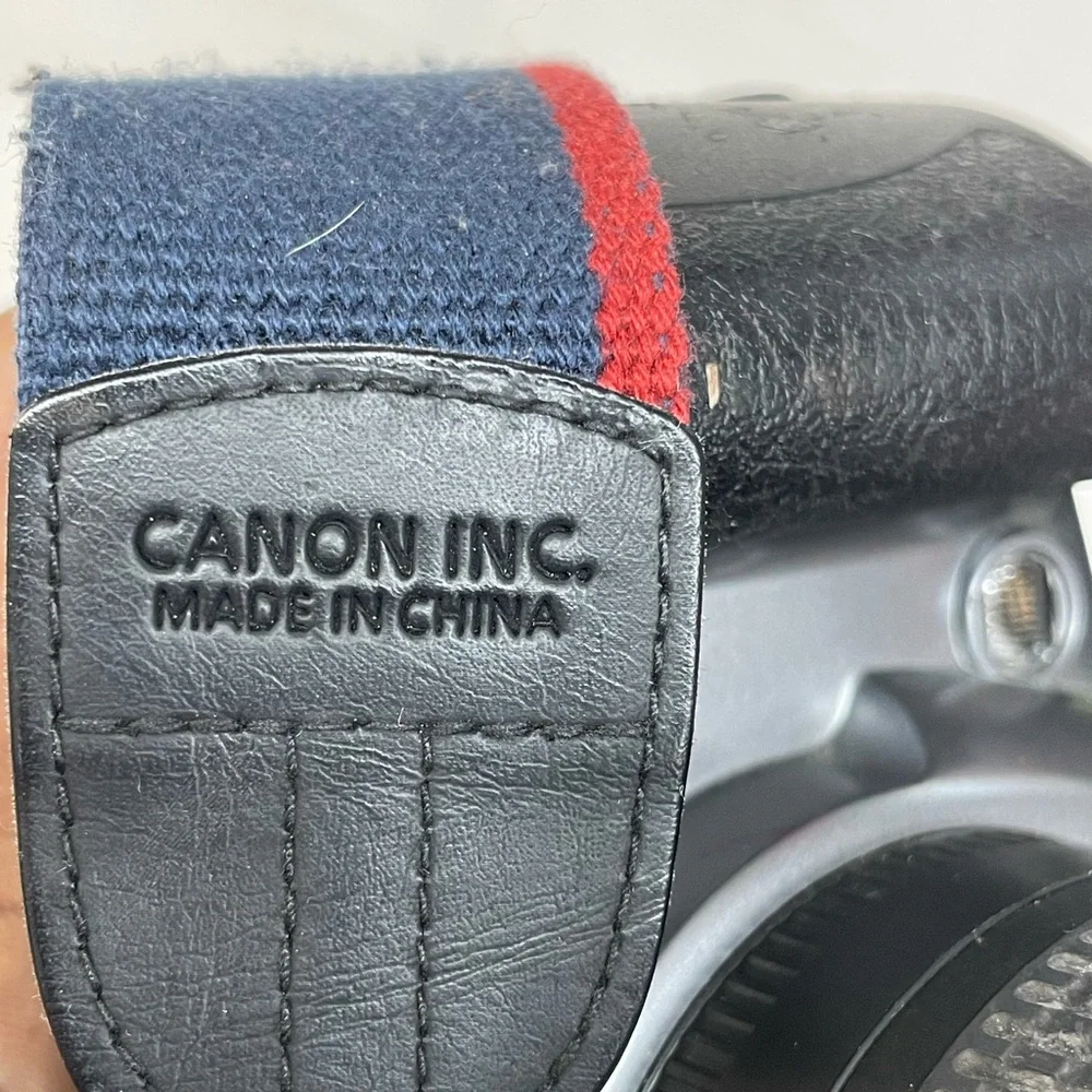 Canon EOS Rebel GII 35mm SLR Camera - Silver & Black with shoulder strap